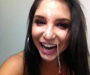 Brunette smiling with cum dripping off her face