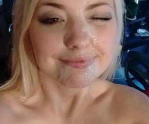 Cute blonde winking with cum on her face