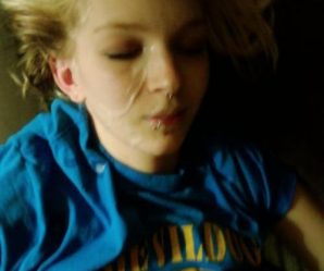 Blonde teen with face piercings enjoying cum