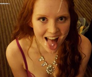 Pretty redhead with her tongue out