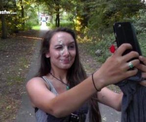 Brunette taking cum selfie in a park