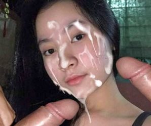 Pretty asian girl cum faked with two cocks in her face